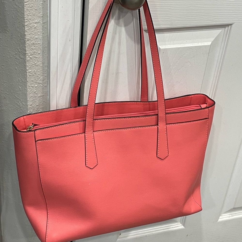Coral color Kate spade bag. Large with laptop sleeve inside.